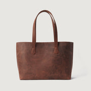 
The Bianca Vintage Distressed Brown Leather Tote Bag For Women - Profil latéral structuré montrant la profondeur du soufflet